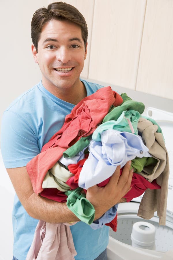 Man Doing Laundry stock image. Image of holding, hispanic 6881763