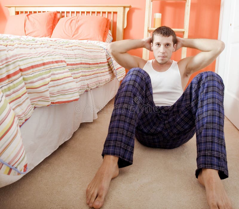 Man Doing SitUps In Bedroom Stock Photo Image of casual, copy 12857490