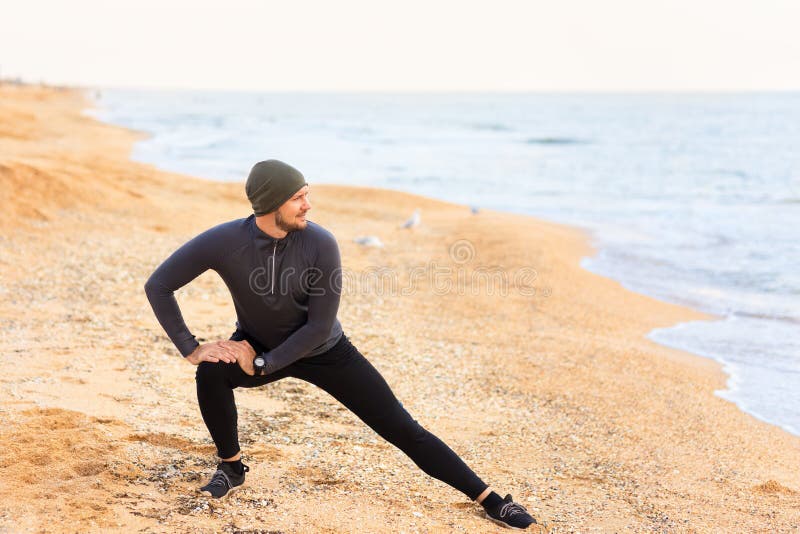 Man Doing Stretch Exercises on the Sea Beach Stock Photo Image of workout, stretch 125721690