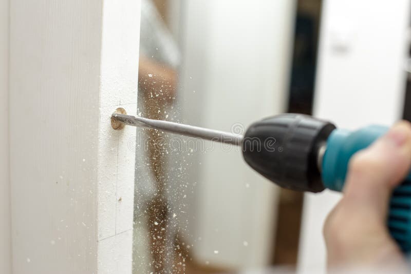 Drilling Door Frame stock image. Image of mustache, caucasian 7469301