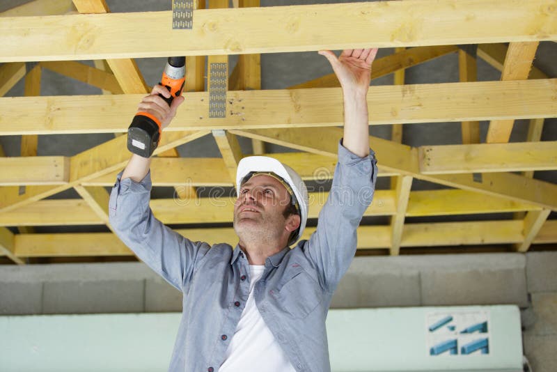 Man Drilling New House Construction Frame Stock Photo Image of