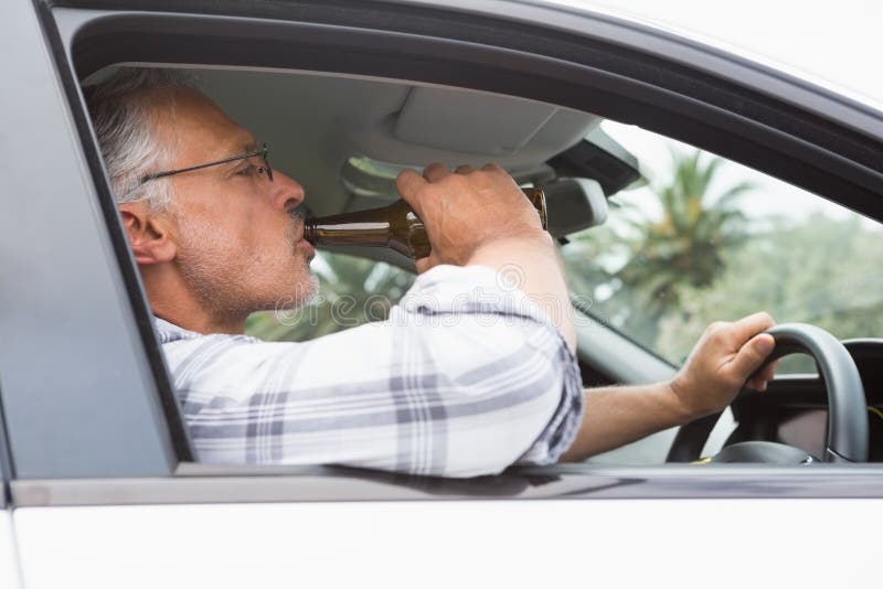 Man Drinking Beer while Driving Stock Photo Image of leisure
