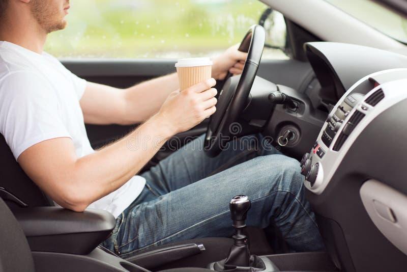 Man Drinking Coffee while Driving the Car Stock Image Image of