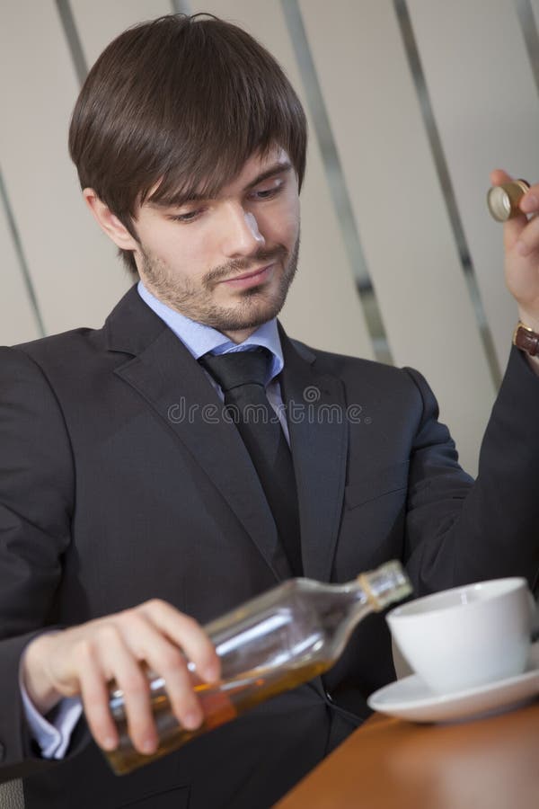 Man drinking by office work