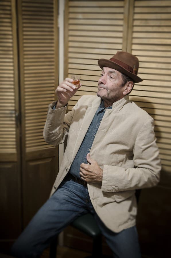 Man Drinking from Shot Glass_1 Stock Image Image of sadness