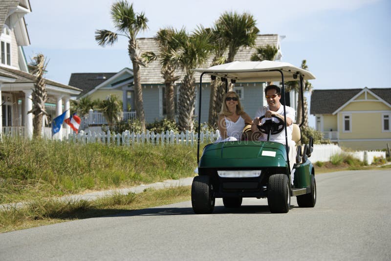 Man driving golf cart stock image. Image of female, adult 2051617