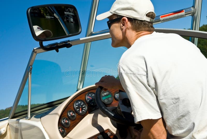 Man Driving Ski Boat stock image