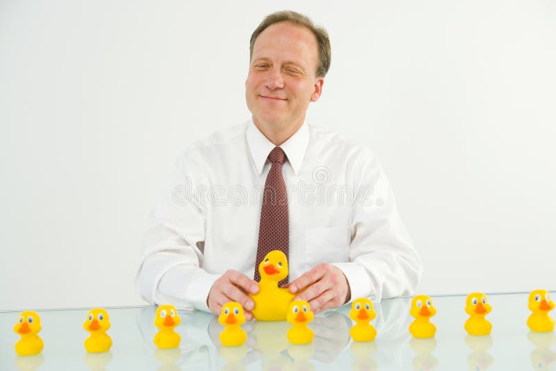 Man with ducks in a row