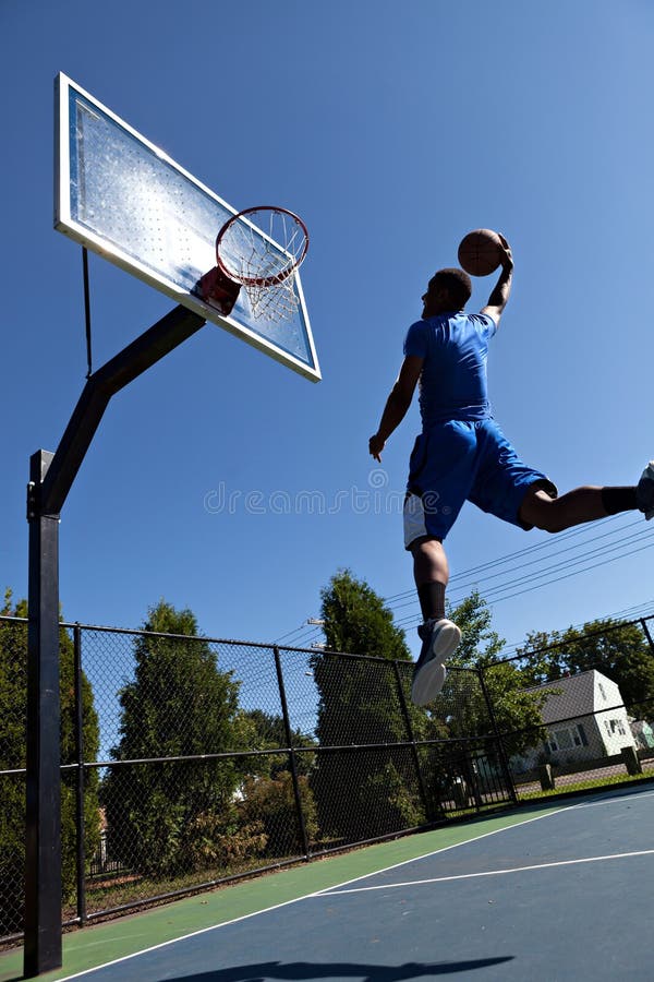 Man Dunking the Basketball