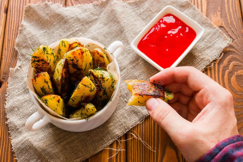 Man eating fried potatoes stock image. Image of potato 71135159
