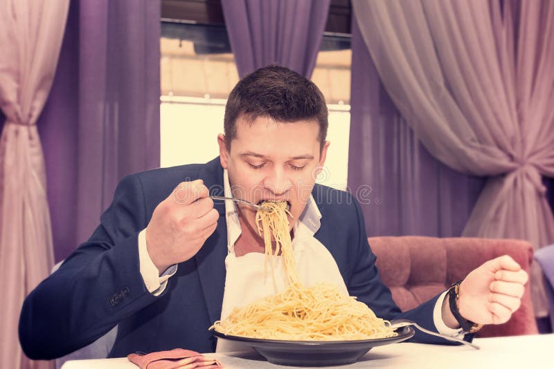 Man eating a large portion of pasta stock photos Man eating a large portion of pasta stock photos