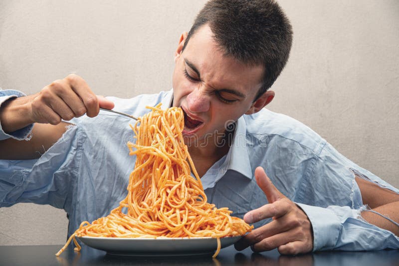 Man Eating Spaghetti with Tomato Sauce Stock Photo Image of food