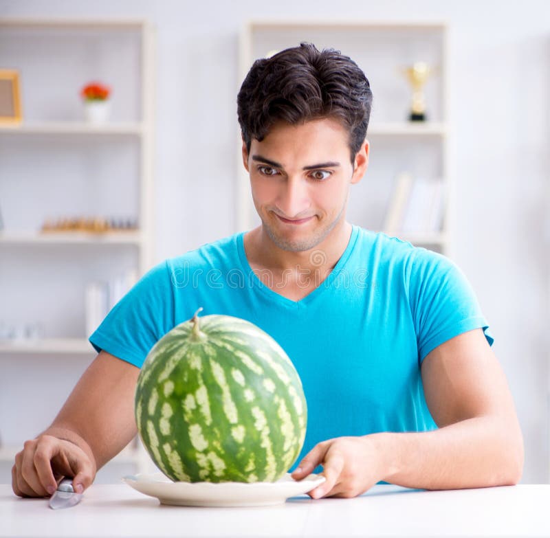 Man Eating Watermelon at Home Stock Photo Image of excited, cheerful 172932992