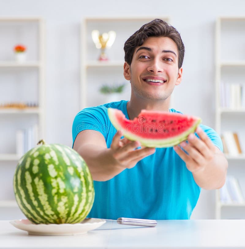 Man Eating Watermelon at Home Stock Photo Image of hungry, organic
