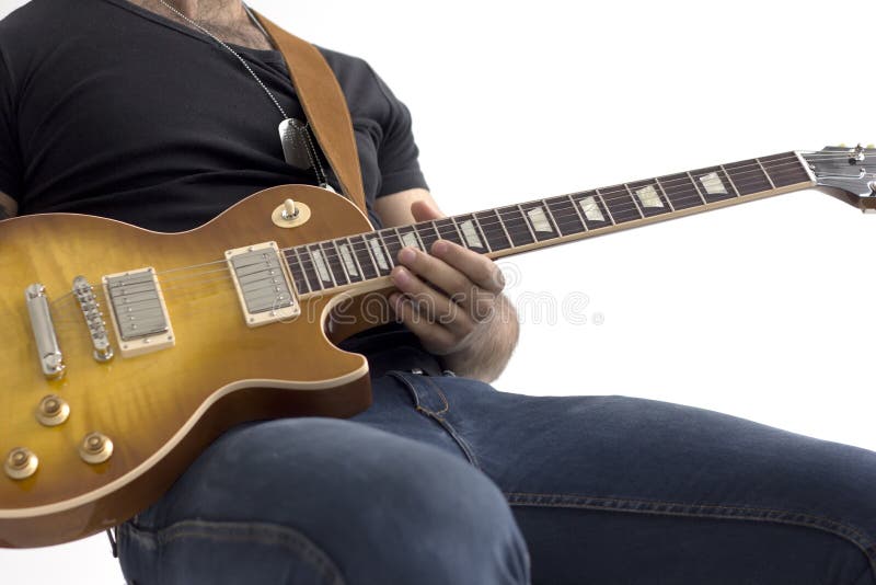 Man with electric guitar sitting isolated over white royalty free stock images Man with electric guitar sitting isolated over white royalty free stock images