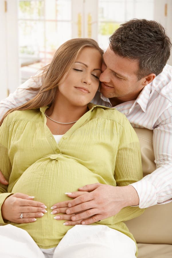 Man embracing pregnant woman royalty free stock photo Man embracing pregnant woman royalty free stock photo