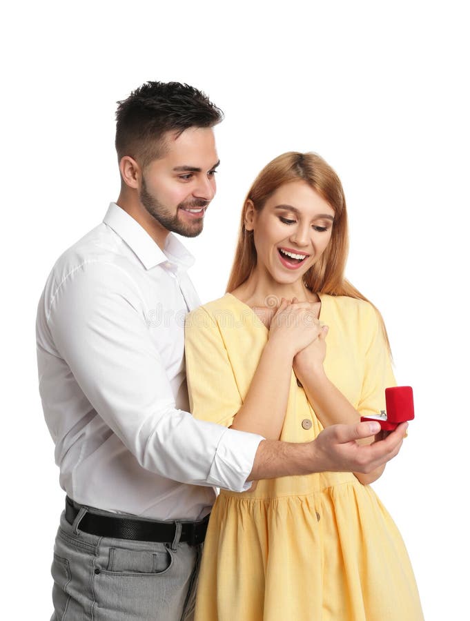 Man with Engagement Ring Making Marriage Proposal To Girlfriend on Background Stock Image