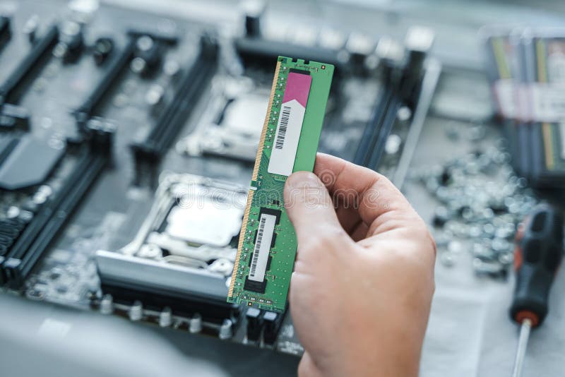 Man engineer,collector. Independent self computer assembly. Mounting in sockets processor,random access memory RAM royalty free stock image