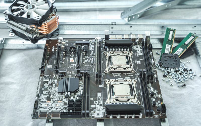 Man engineer,collector. Independent self computer assembly. Mounting in sockets processor,random access memory RAM royalty free stock photography