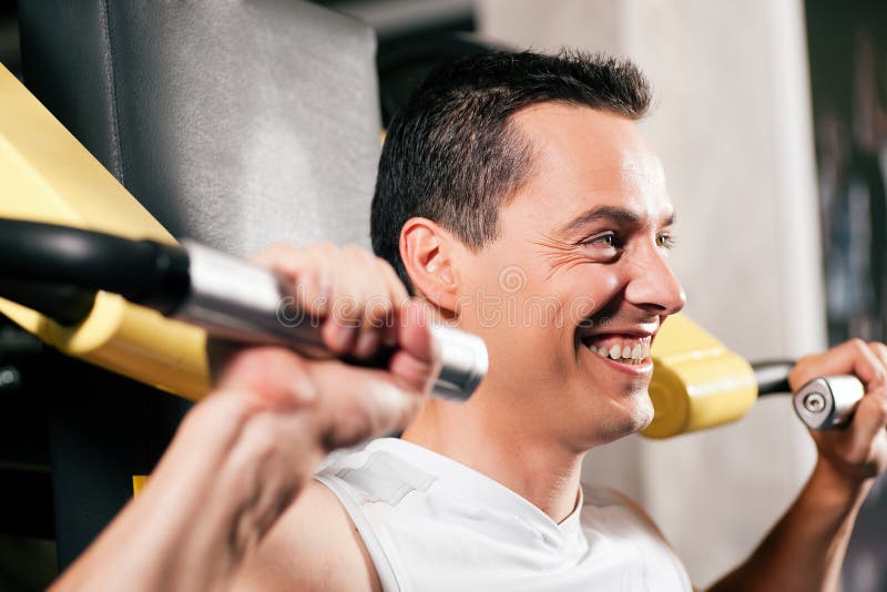 Man exercising and training in gym