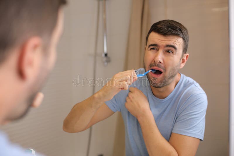 Man Experimenting Pain while Brushing His Teeth Stock Photo Image of