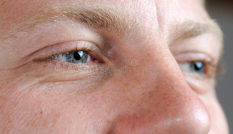 Brown Eye Part Of A Male Face Focus On Pupil Stock Photo