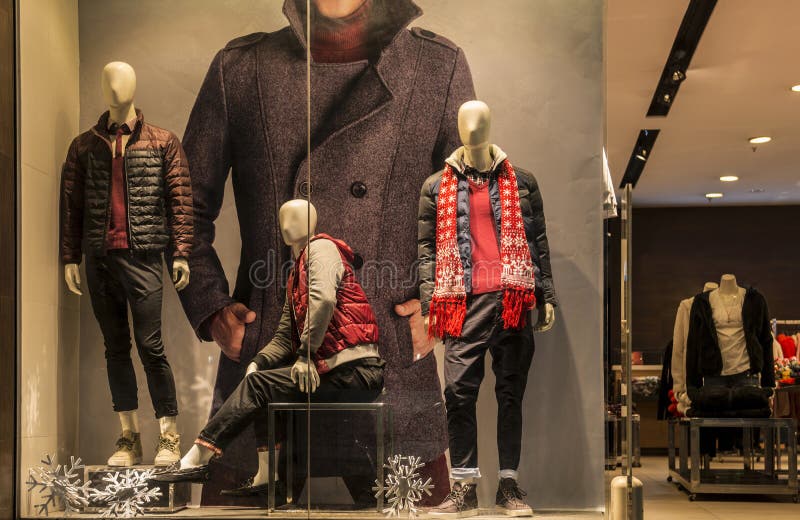 man fashion clothing shop window with mannequins, christmas decoration,dress store window, shop decoration