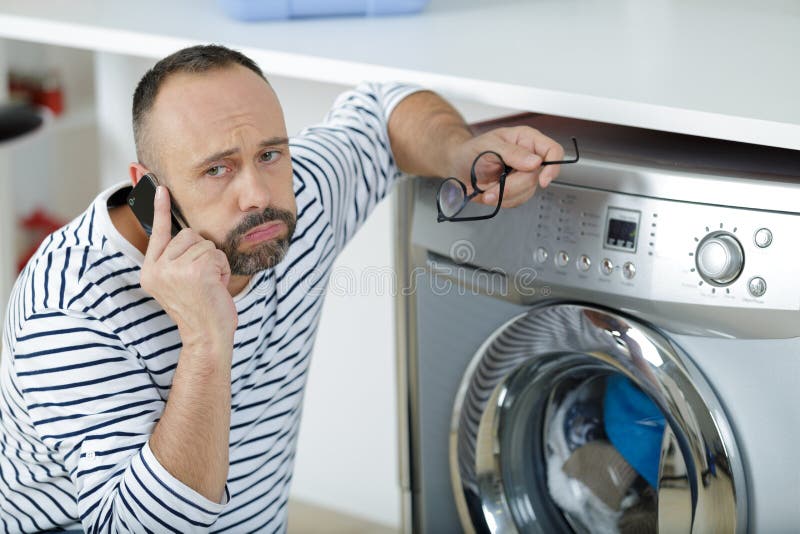 man-fed-up-during-call-to-washing-machine-helpline-stock-image-image