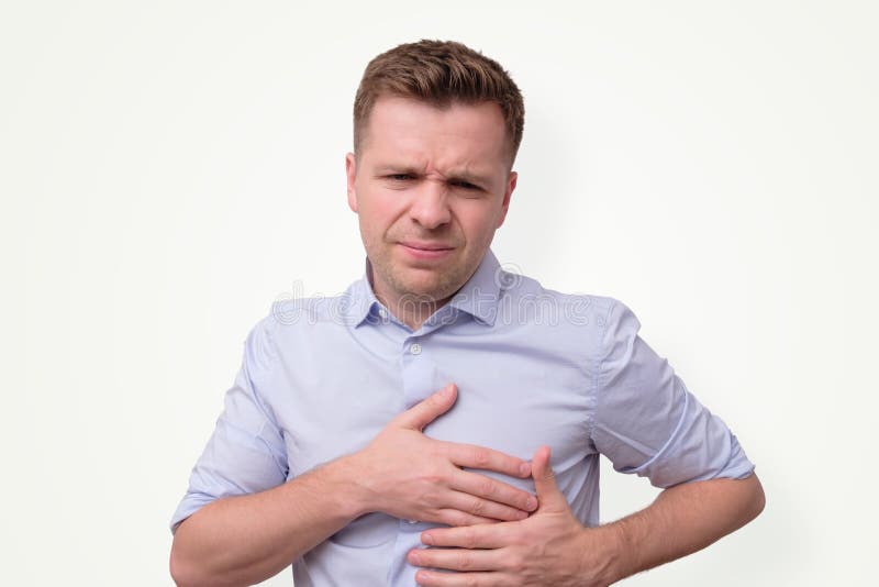 Man feeling having heart attack symptom or breast cancer