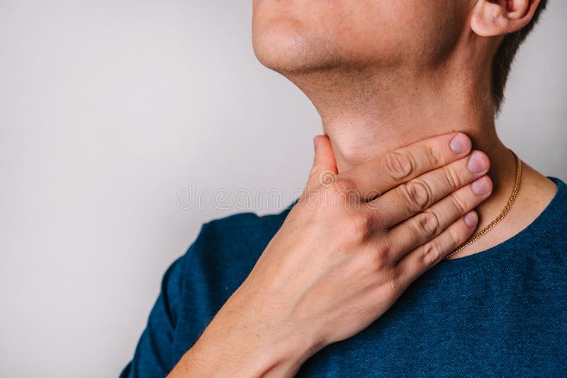 The Man Feels a Sore Throat and Checks the Tonsils and Lymph Nodes