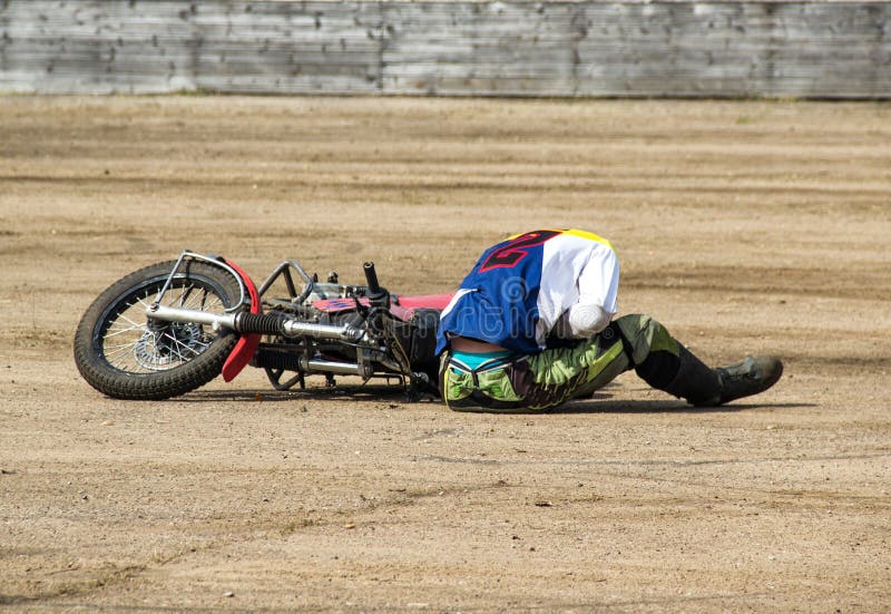 The man fell from a motorcycle and holds on to the abdomen, trauma at a road traffic accident, game