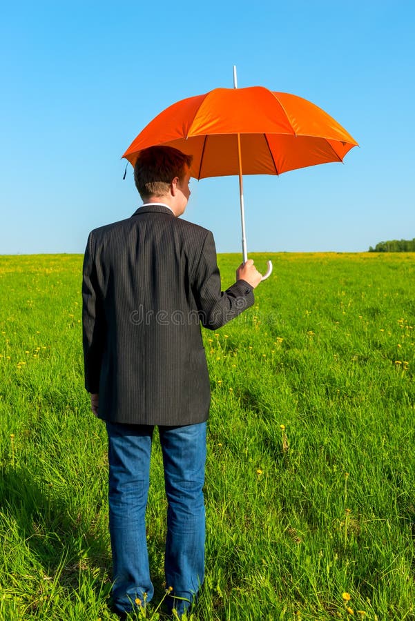 Man in the Field with Umbrella Stock Image Image of person, open