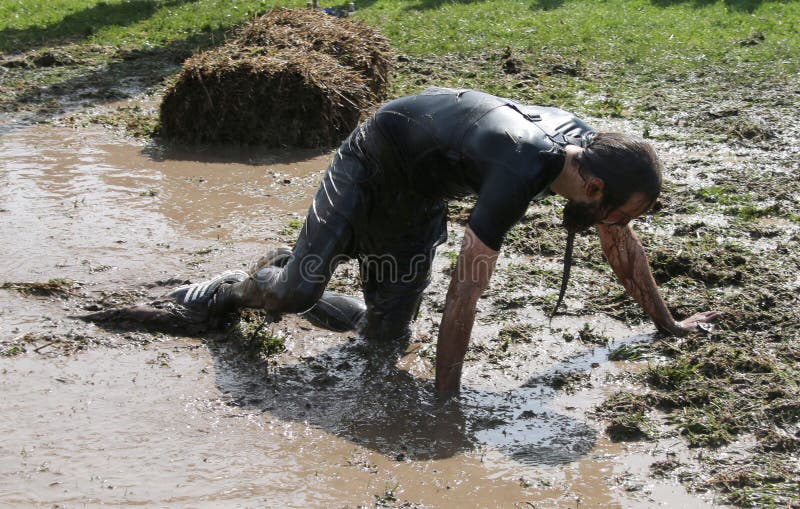 Man Fighting To Get through the Mud on His Knees Editorial Stock Photo ...