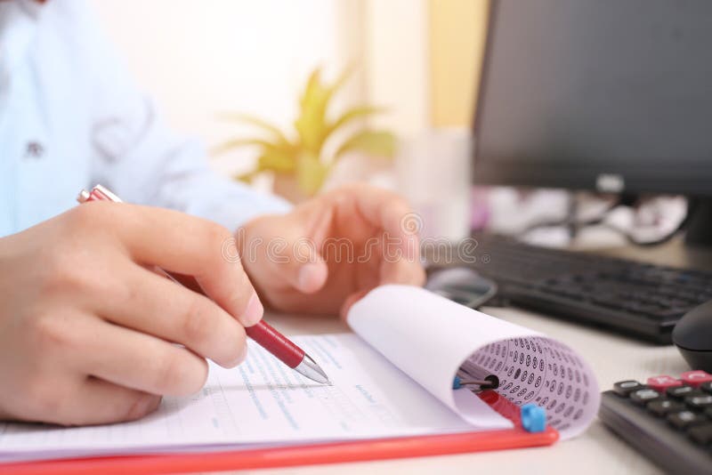 Man is Filling Form with Pen. Picture of Calculator, Mouse and Glasses on the Table Stock Photo ...