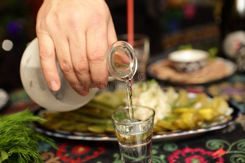 Man filling vodka