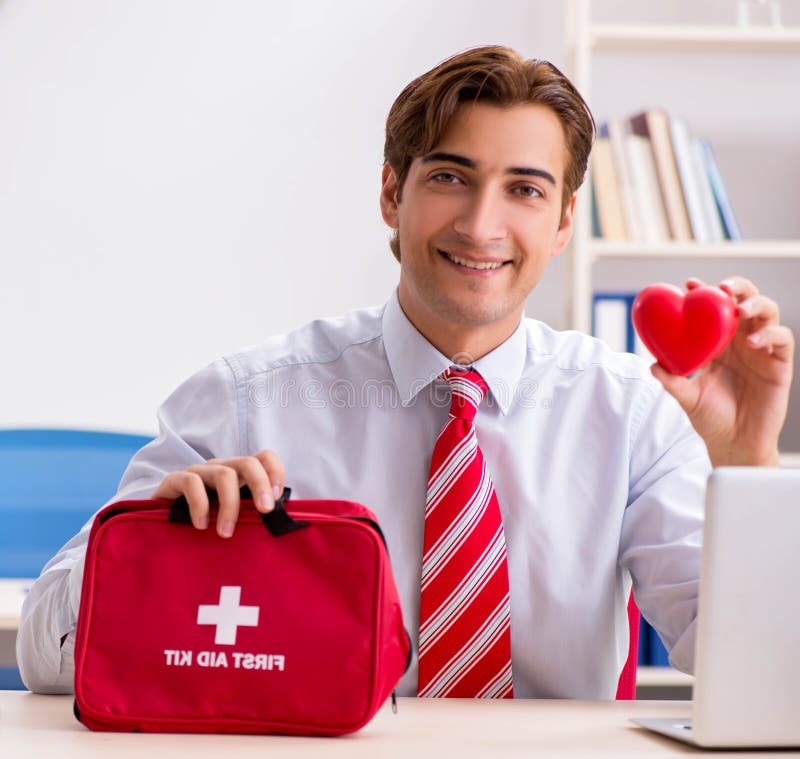 Man with First Aid Kit in the Office Stock Photo Image of emergency, cross 179070224