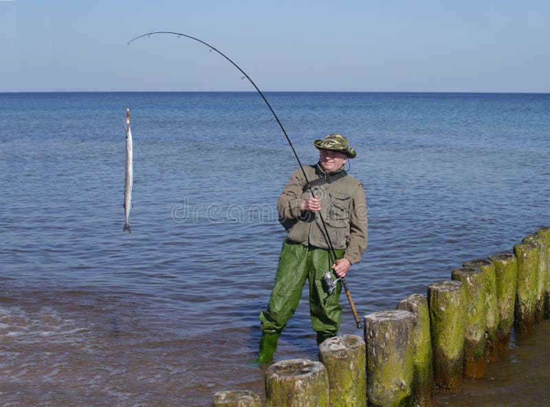 Man with fish and fishing-rod