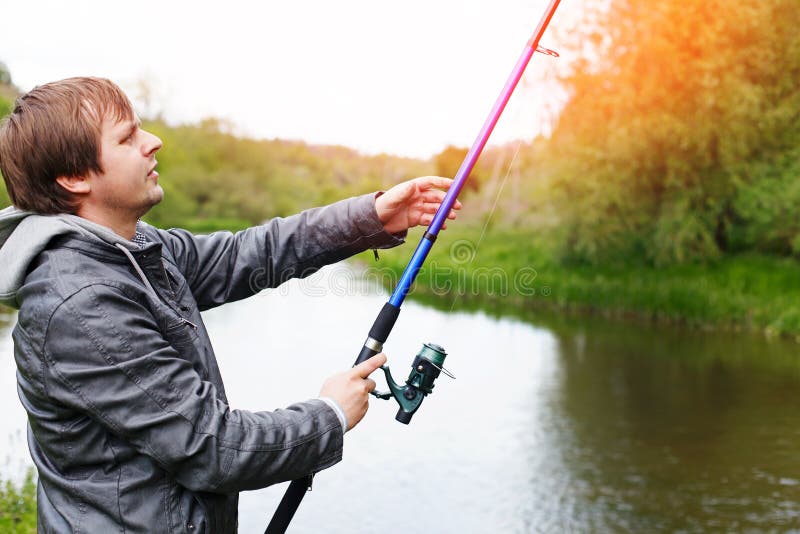 Man with Fishing Rod on the Shore of River Stock Image Image of blue