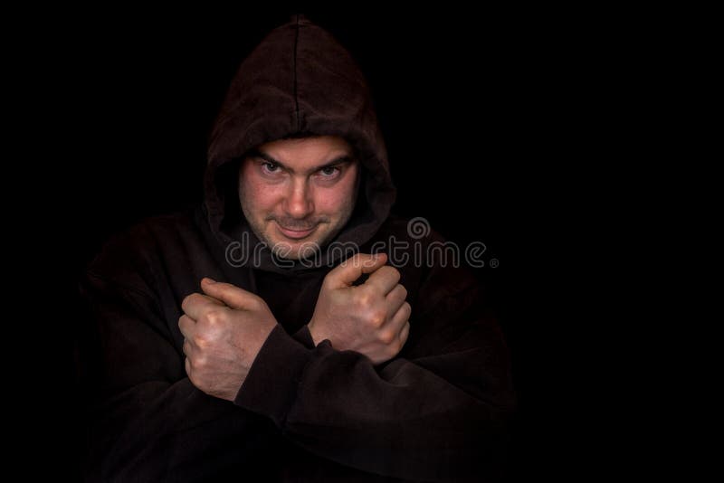 Man with fists and crossing arms isolated on black stock images Man with fists and crossing arms isolated on black stock images