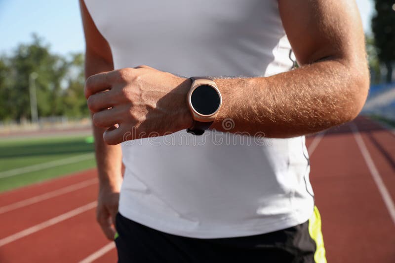Man with Fitness Tracker Running at Stadium Stock Photo Image of