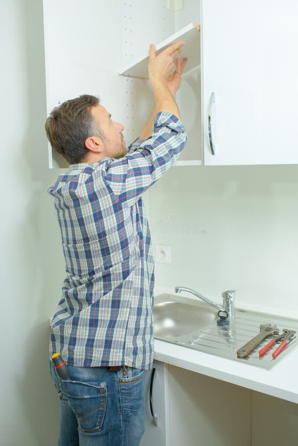 Man Fitting New Kitchen Units Stock Photos Free & RoyaltyFree Stock