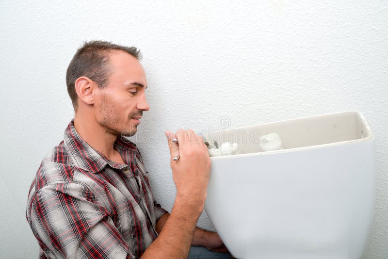 Man fitting toilet stock photo. Image of handsome, profession 186131970