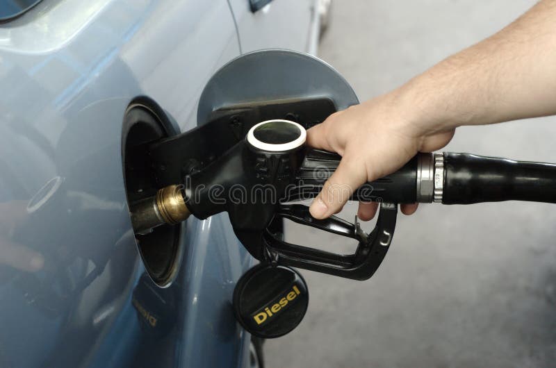 Man fueling car with diesel