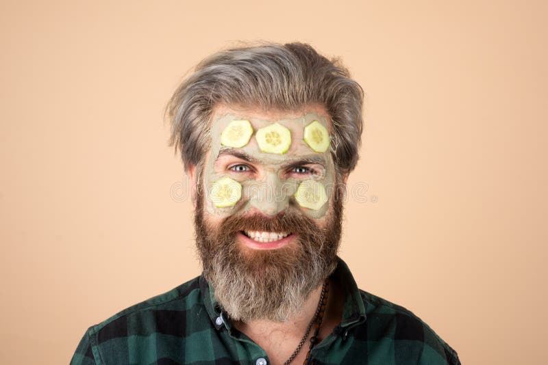 Man with Fun Facial Mask with Cucumber. Spa Man Applying Facial Clay ...