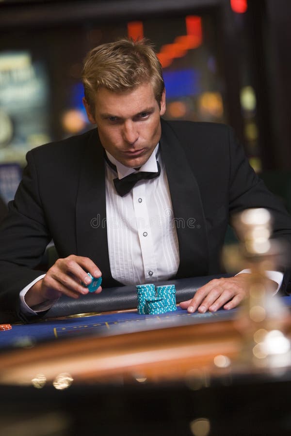 Man Gambling at Roulette Table Stock Image Image of dress, indoors