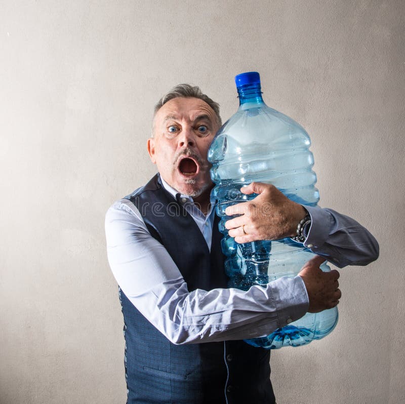 Man with a Giant Water Bottle Stock Image - Image of oversized, exhausted:  128843799