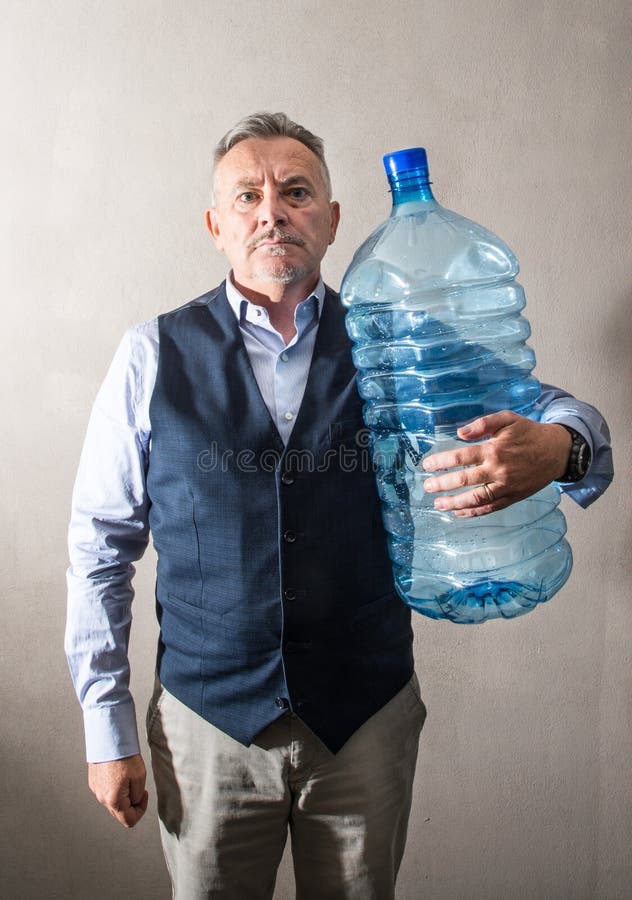 Man with a Giant Water Bottle Stock Image - Image of oversized, exhausted:  128843799