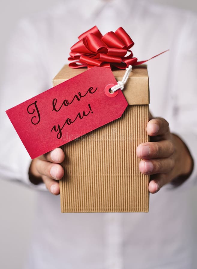 Man with gift with text I love you stock photos Man with gift with text I love you stock photos