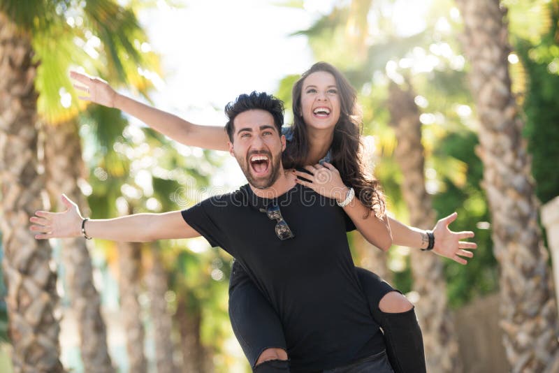 Man Giving Piggyback Ride To His Girlfriend Stock Photo - Image of  cheerful, person: 41022350