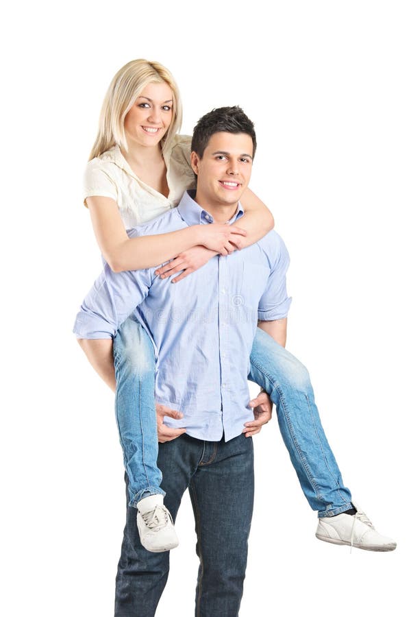 Young couple enjoying piggyback ride isolated on gray background Stock  Photo - Alamy